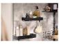 LIVARNO home Deux étagères de douche noires avec des cosmétiques sur un mur gris.