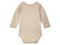 Body bébé beige à manches longues.