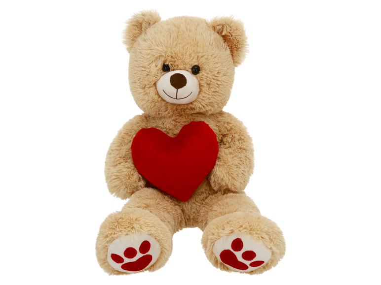 Ours en peluche beige avec un cœur rouge