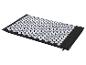 Tapis d'acupression noir avec pointes blanches pour la relaxation et le soulagement de la douleur.