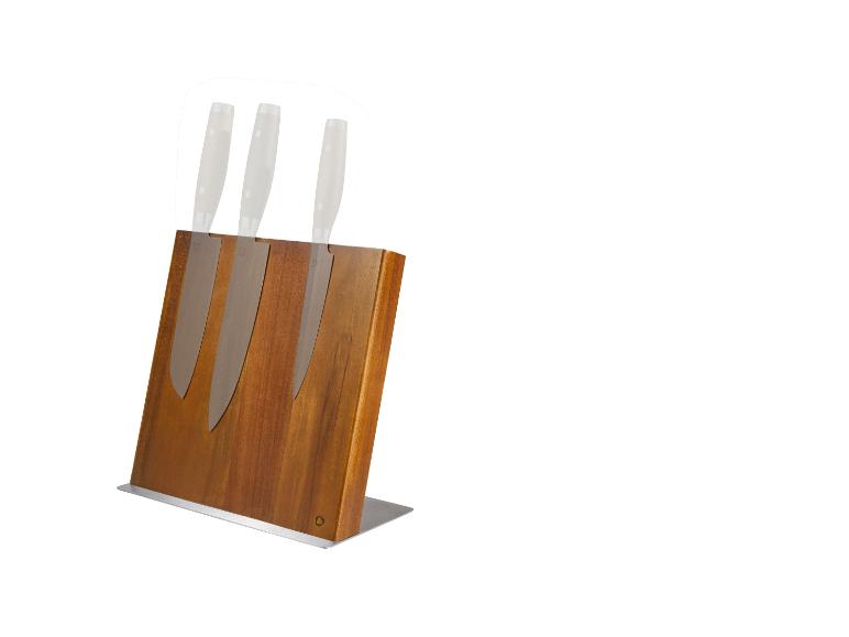 Bloc à couteaux en bois avec trois couteaux aux manches blancs.