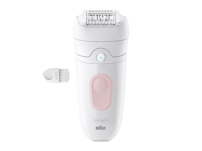Épilateur électrique avec panneau de commande rose et brosse de nettoyage.