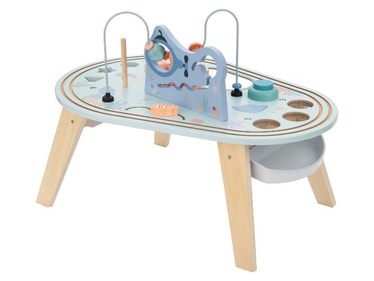 Table d'activités en bois sur le thème marin avec un labyrinthe de perles.
