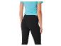 Leggings noirs et t-shirt turquoise pour le sport.