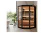 Sauna infrarouge moderne avec porte vitrée et intérieur en bois dans une salle de bain