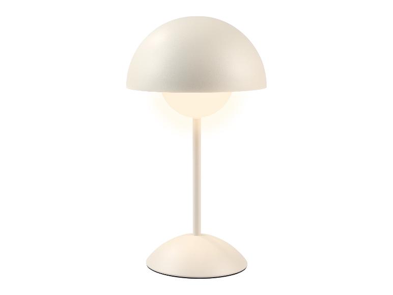 Lampe de table blanche avec un abat-jour hémisphérique et une ampoule allumée.