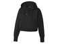 Un sweat à capuche noir avec fermeture éclair de Crivit.