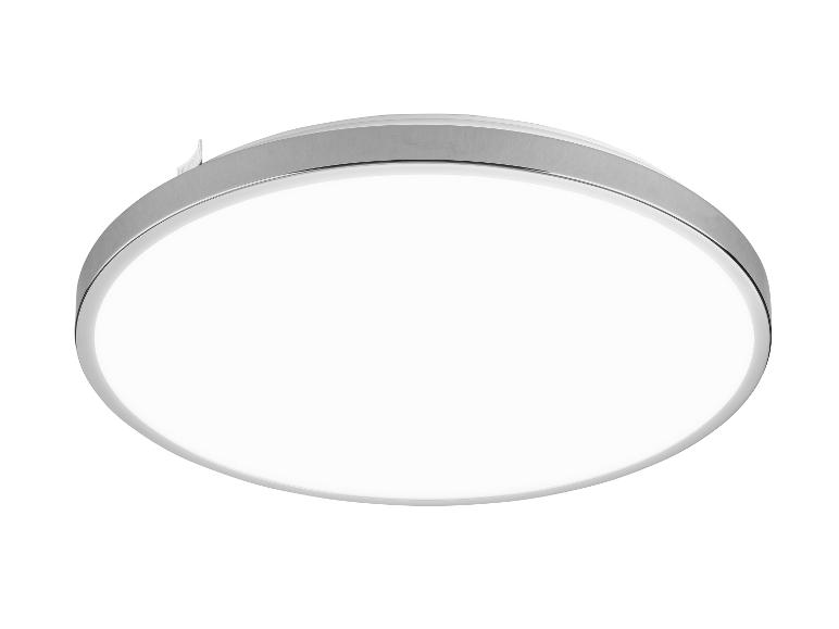 Plafonnier LED rond et moderne avec un cadre en métal brossé.