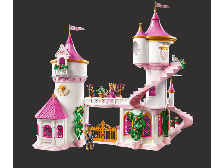 Château de jouet blanc et rose avec des figurines et un portail doré.