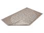 Tapis beige avec un motif géométrique de lignes blanches