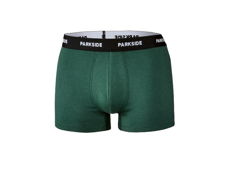 Boxers en coton vert foncé avec ceinture élastique noire et texte blanc.