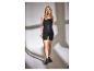 Femme posant en débardeur noir et short cycliste ESMARA®.