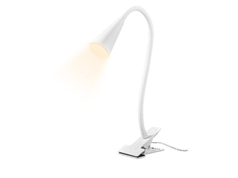Lampe de bureau LED blanche avec bras flexible et pince, émettant une lumière chaude.