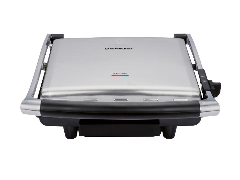 Un grill électrique SilverCrest en acier inoxydable avec indicateurs de puissance et de prêt.