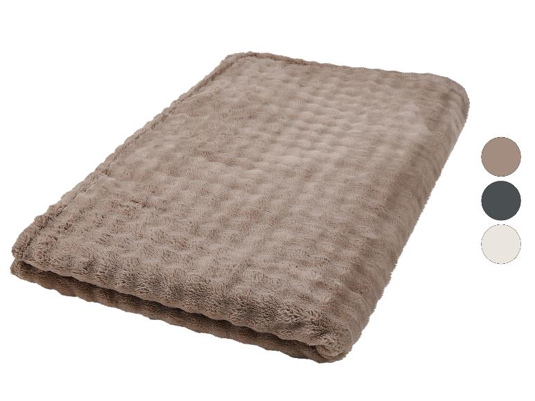 Couverture douce marron avec motif en relief et cercles de sélection de couleur.