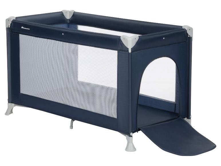 Un lit de voyage bleu marine avec filet, une ouverture latérale zippée et le logo Bebeconfort.