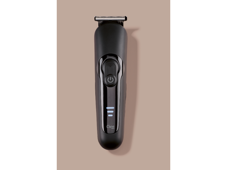 Tondeuse à cheveux noire avec bouton d'alimentation et indicateur de charge
