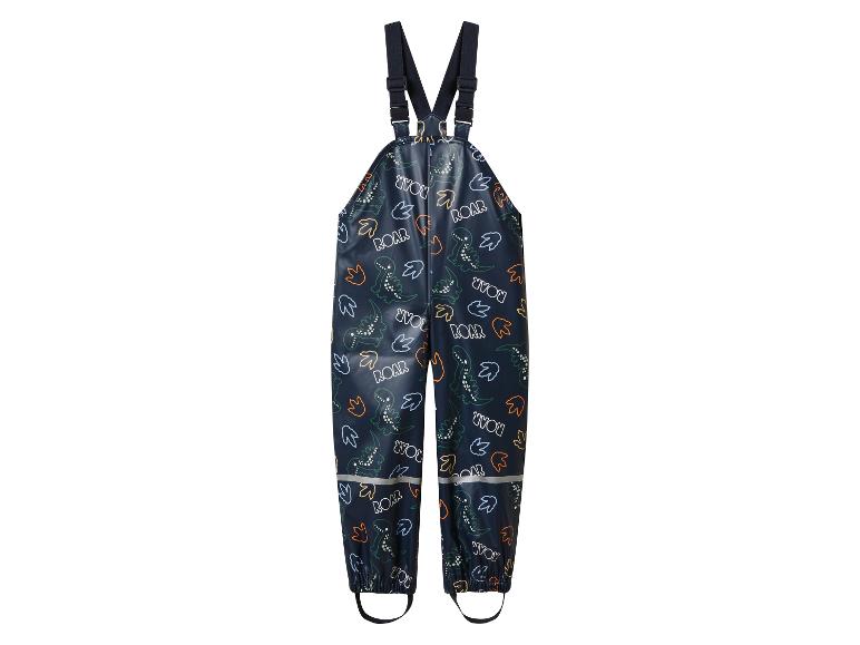 Salopette imperméable pour enfants avec imprimé dinosaure et détails réfléchissants.