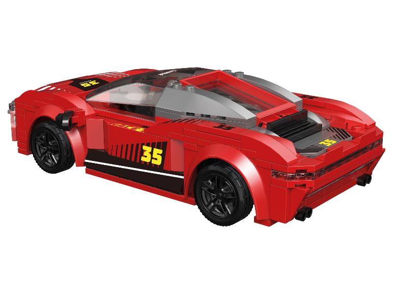 Voiture de course jouet rouge avec le numéro 35 et toit transparent.