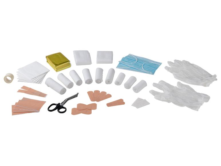 Trousse de premiers secours avec bandages, pansements, masques, gants et ciseaux.