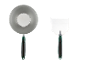 Un bol en métal et une spatule avec des manches vertes.