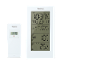 Station météo sans fil blanche avec capteur extérieur.