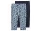 Deux leggings pour filles, l'un à imprimé coquillages et l'autre uni bleu foncé.