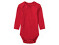 Un body bébé rouge à manches longues.