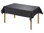 Une nappe noire avec un motif géométrique sur une table en bois.