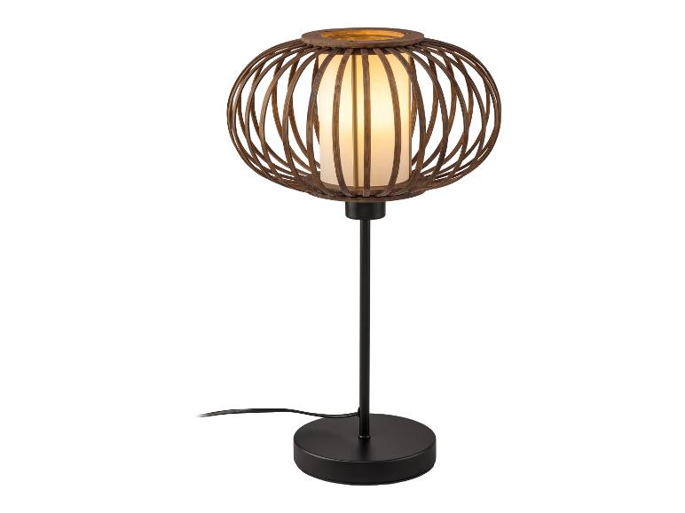 Une lampe de table noire avec un abat-jour rond en bois.
