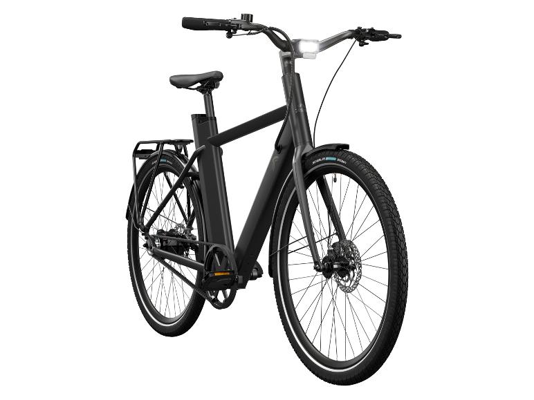 Un vélo électrique noir avec un pneu Schwalbe.