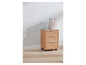 Une armoire en bois à trois tiroirs et roulettes, remplie de classeurs Paperworks.