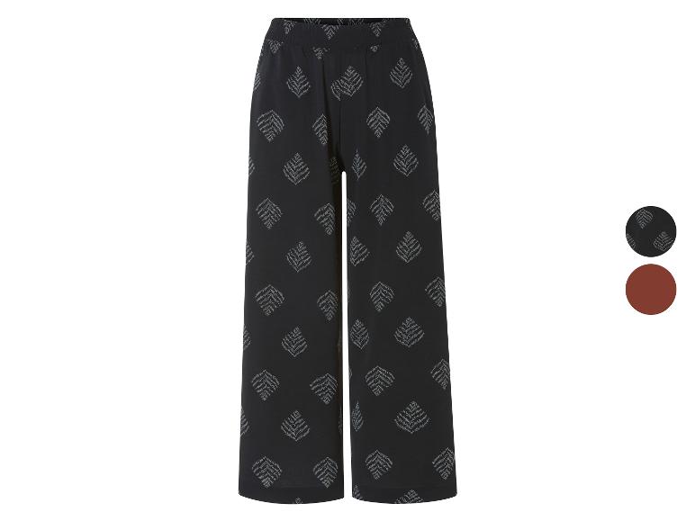 Pantalons amples à motif feuilles, disponibles en noir et brun.