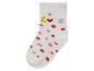 Chaussette blanche à pois rouges et inscription 'Love'.