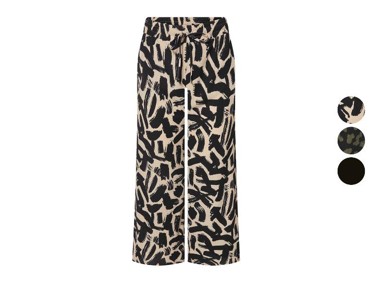 Pantalon large à imprimé abstrait beige et noir.