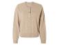 Un pull en tricot beige avec des boutons.