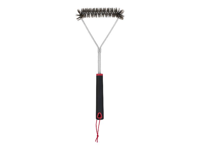 Brosse de nettoyage pour barbecue avec poignée noire et cordon rouge.