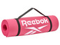 Un tapis de yoga rose Reebok avec une sangle de transport.