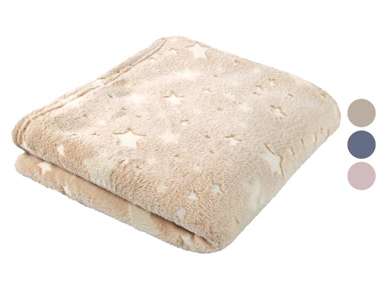 Douce couverture étoilée beige.