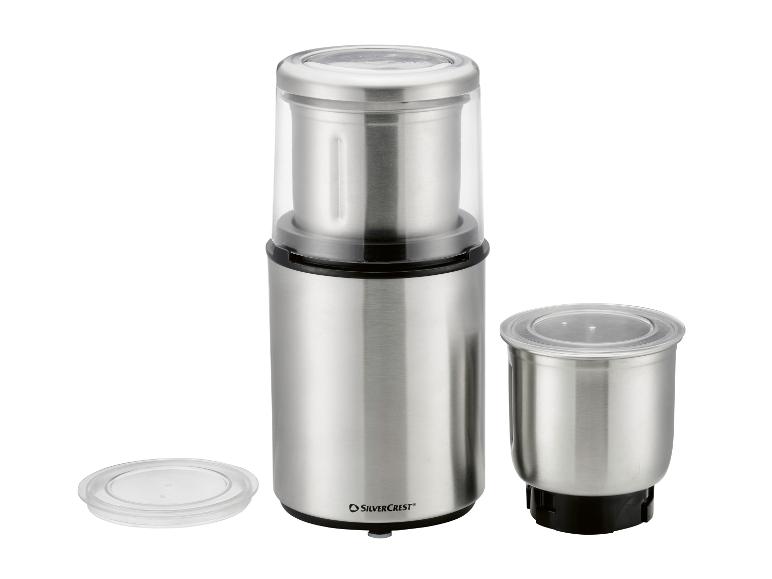 Moulin à café et épices en acier inoxydable avec deux récipients et couvercles transparents.