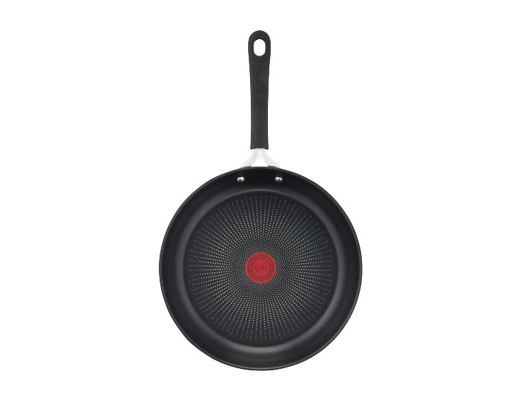 Poêle noire antiadhésive avec manche, vue de dessus.