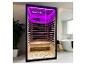 Sauna infrarouge avec éclairage LED violet dans une salle de bain moderne.