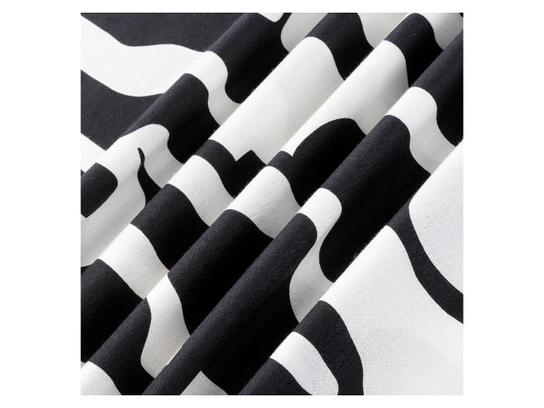 Tissu rayé noir et blanc avec des motifs ondulés.