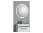 Miroir rond éclairé au-dessus d'un lavabo rectangulaire avec robinet chromé et meuble blanc.
