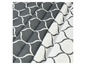Draps gris et blancs avec un motif géométrique.