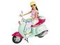 Poupée Barbie sur un scooter vert menthe avec des détails roses.