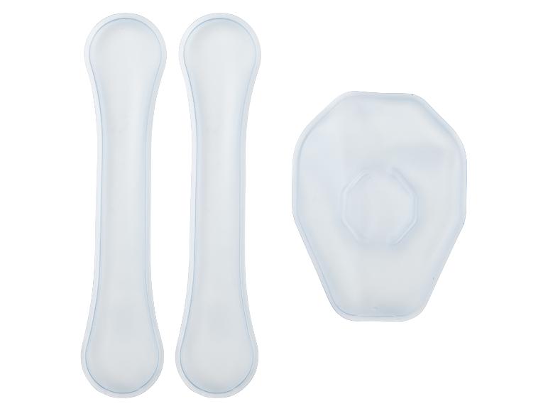 Deux coussinets en silicone longs et étroits et un coussinet en silicone hexagonal, tous blancs translucides.