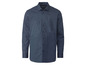 Une chemise bleu marine à pois blancs.