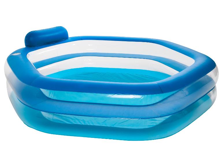 Piscine gonflable bleue et blanche avec appui-tête.