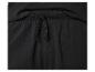 Détail de la taille élastique avec cordon de serrage d'un pantalon de survêtement noir.